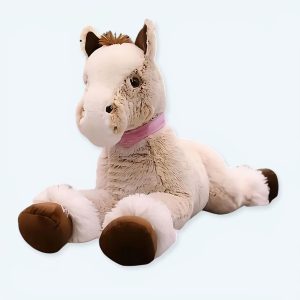 Cavallo beige di peluche sdraiato